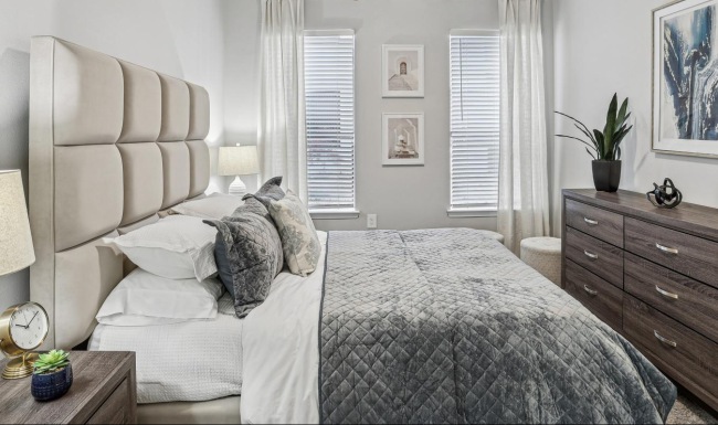 a bedroom with a bed and a couch